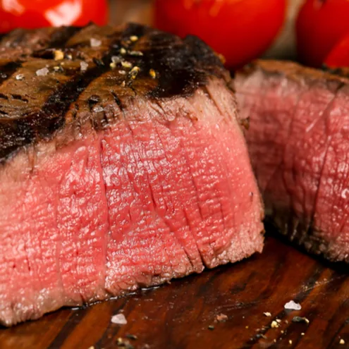 A cooked fillet steak, cut to show the cross-section